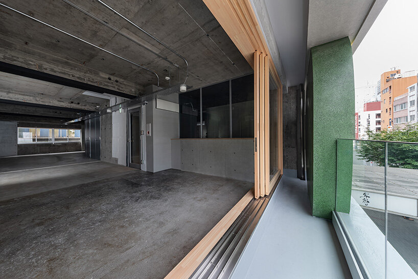 sculptural ovals shape seismic retrofit of 50-year-old building in japan by C+A