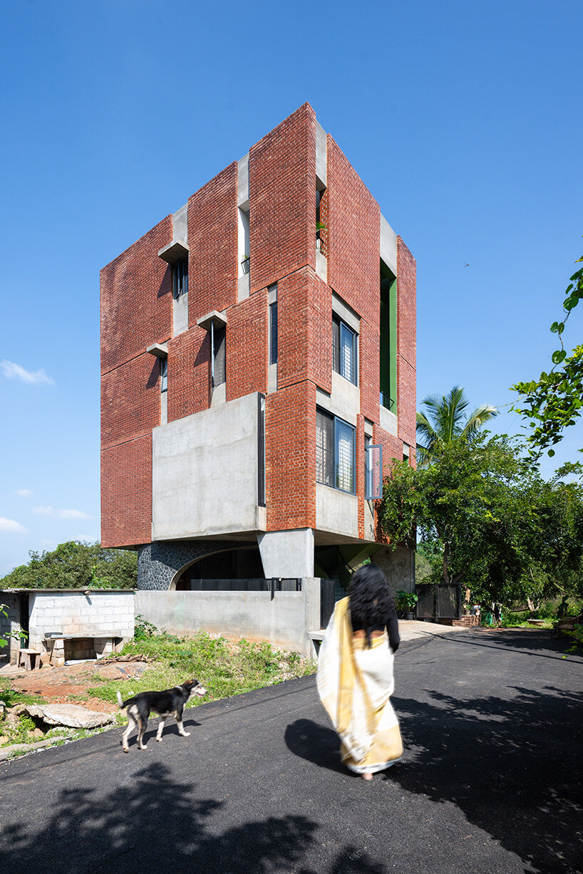 studio ShoulderTap contrasts brick and stone to shape family residence in india