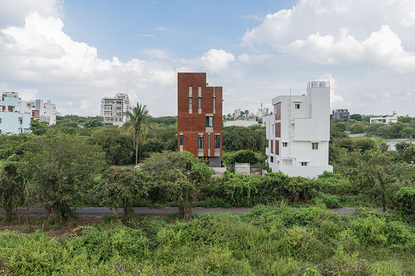 studio ShoulderTap contrasts brick and stone to shape family residence in india