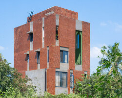 studio ShoulderTap contrasts brick and stone to shape family residence in india