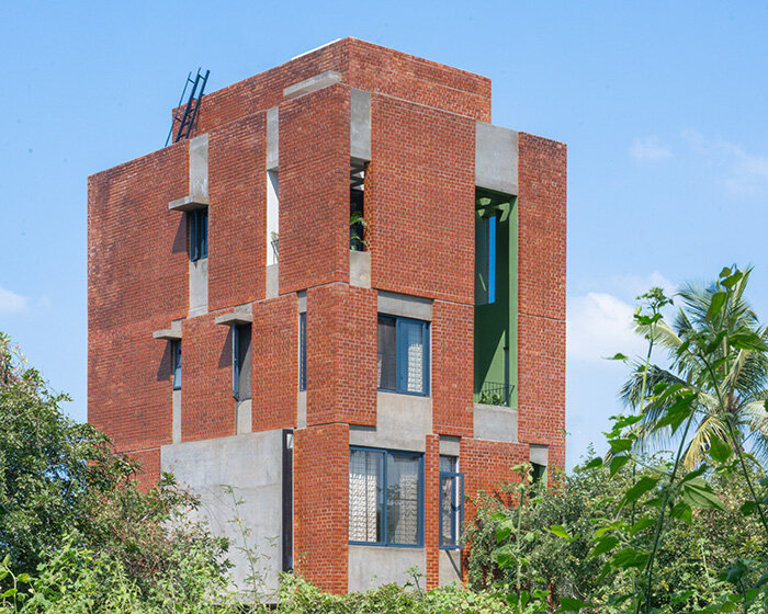 studio ShoulderTap contrasts brick and stone to shape family residence in india