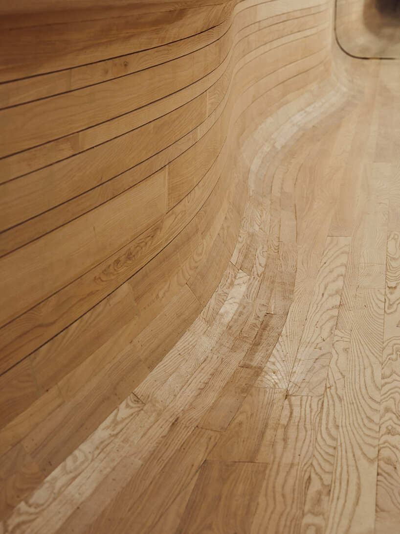 selgascano and curtis su envelop % arabica new york café in handcrafted timber cocoon