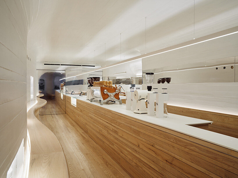 selgascano and curtis su envelop % arabica new york café in handcrafted timber cocoon
