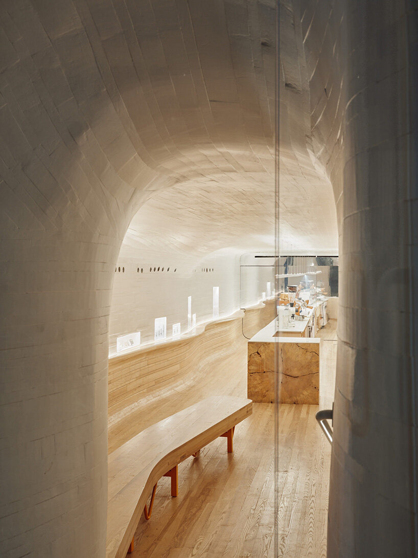 selgascano and curtis su envelop % arabica new york café in handcrafted timber cocoon
