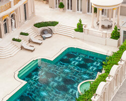SICIS creates glowing swimming pool surface with decorative glass for cambodian villa