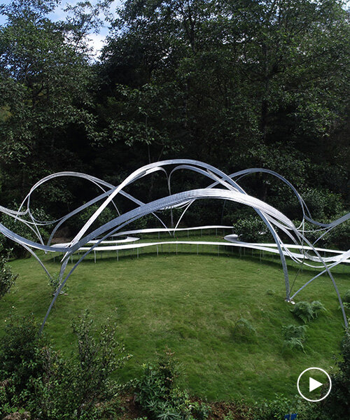 slender steel arcs blossom into kong xiangwei studio's camellia-like theater in china