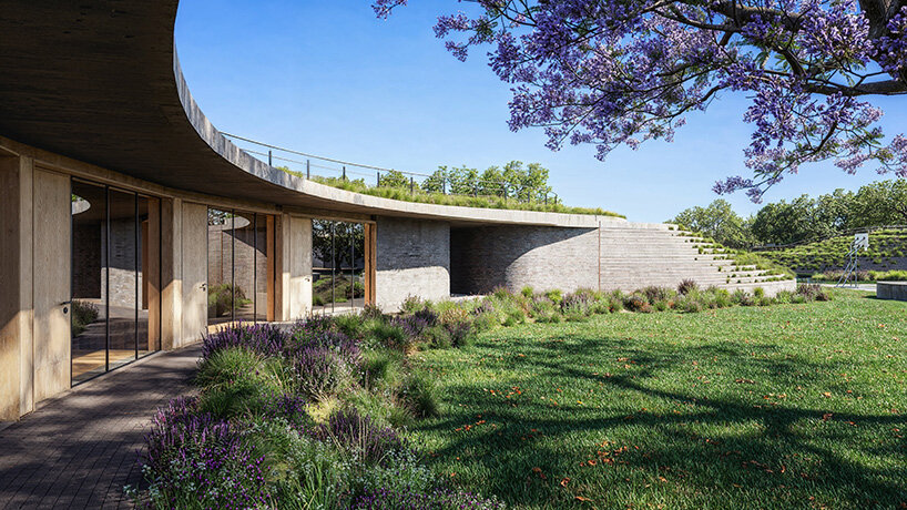 sordo madaleno embeds circular school into volcanic terrain at the foot of mexican pyramid