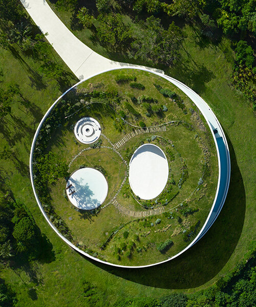 sou fujimoto's circular green-roofed villa for NOT A HOTEL opens on ishigaki island, japan