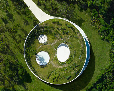 sou fujimoto's circular green-roofed villa for NOT A HOTEL opens on ishigaki island, japan