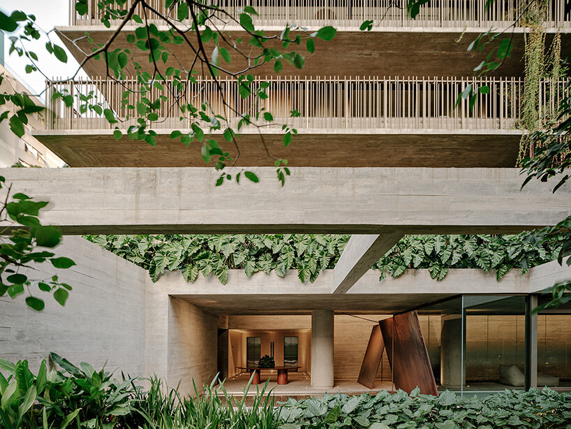 studio arthur casas wraps ribbed concrete tower with vertical gardens in são paulo