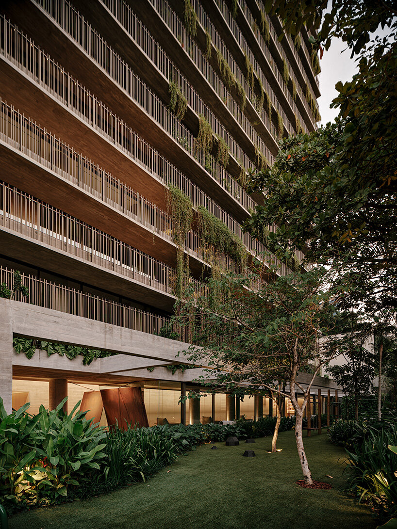 studio arthur casas wraps ribbed concrete tower with vertical gardens in são paulo