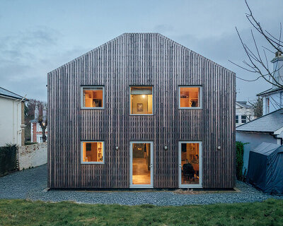 studio bark retrofits victorian-era 'meadow house' with cork and timber extension