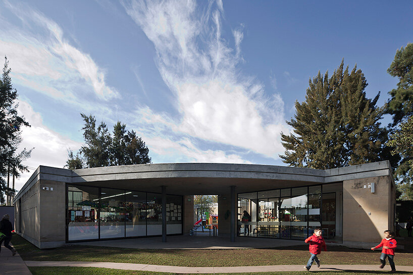 tatiana bilbao shapes rammed earth preschool in mexico around central tree