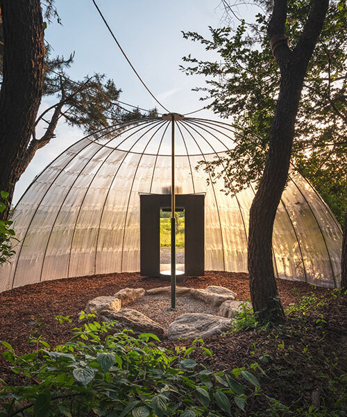 one-aftr frames urban stillness with suspended mesh 'open hut' in south korea