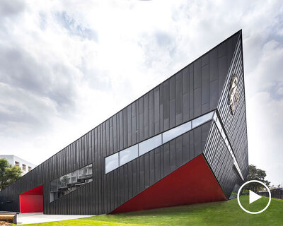 pyramidal steel roof by thirdspace tops university's sports arena in india