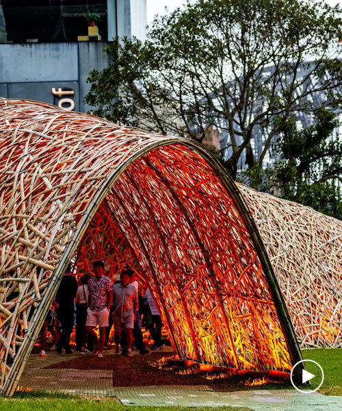 thousands of hand-split bamboo strands weave curved tunnel by cave urban in sydney