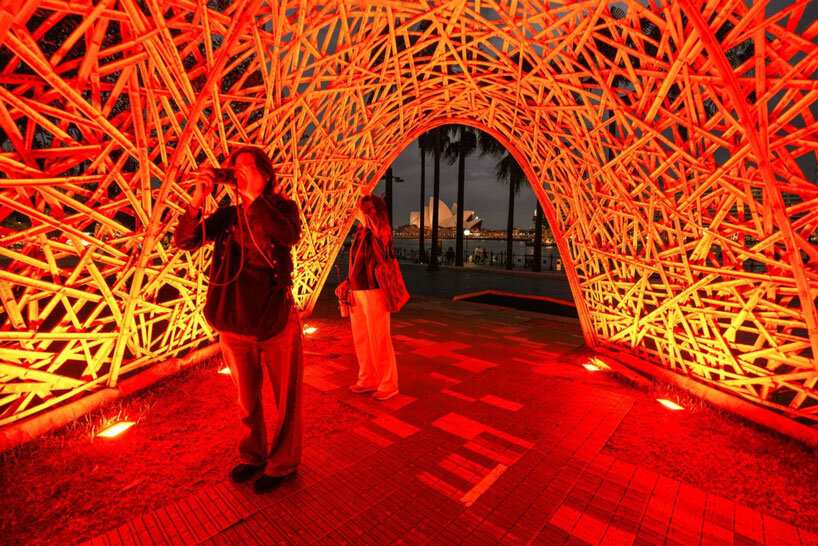 thousands of hand-split bamboo strands weave curved tunnel by cave urban in sydney