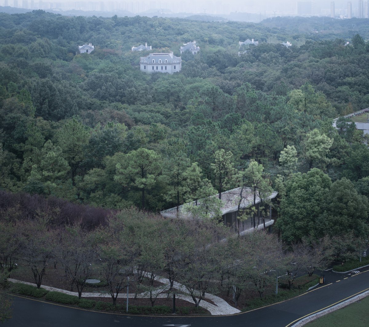 WUWU atelier's restrooms perch like concrete clouds and cavernous crevices in china forest