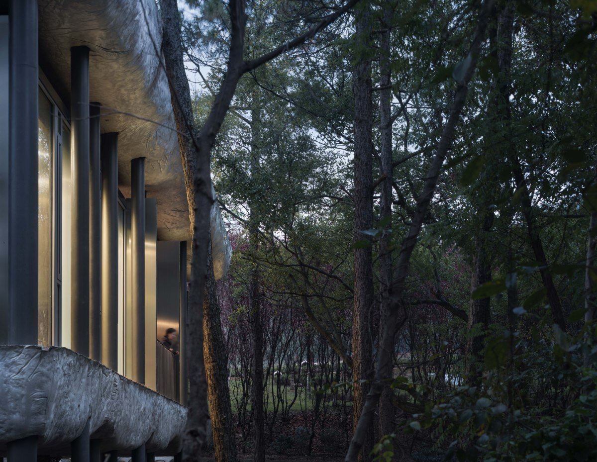 WUWU atelier's restrooms perch like concrete clouds and cavernous crevices in china forest