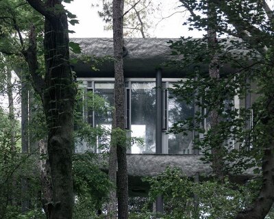 WUWU atelier's restrooms perch like concrete clouds and cavernous crevices in china forest