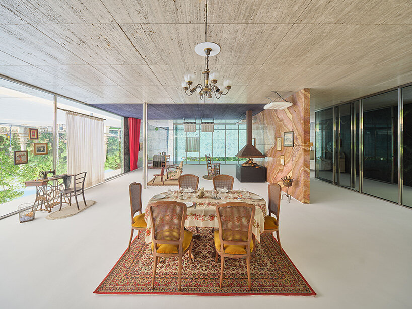 xevi bayona flips mies van der rohe's barcelona pavilion with ceiling-bound household relics