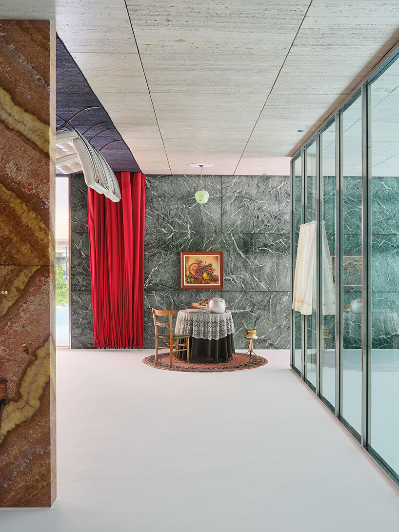 xevi bayona flips mies van der rohe's barcelona pavilion with ceiling-bound household relics