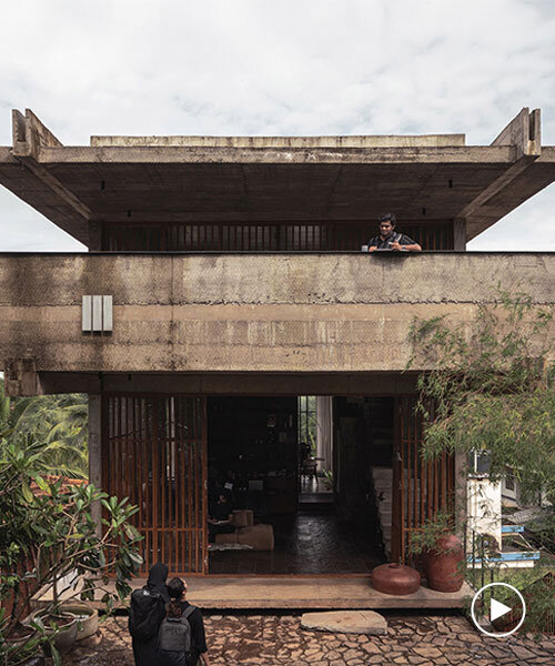 hybrid office-residence extends raw concrete balcony above recessed timber mass in india