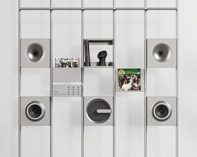 aluminum grid sound wall imagines modular speaker system as central furniture piece