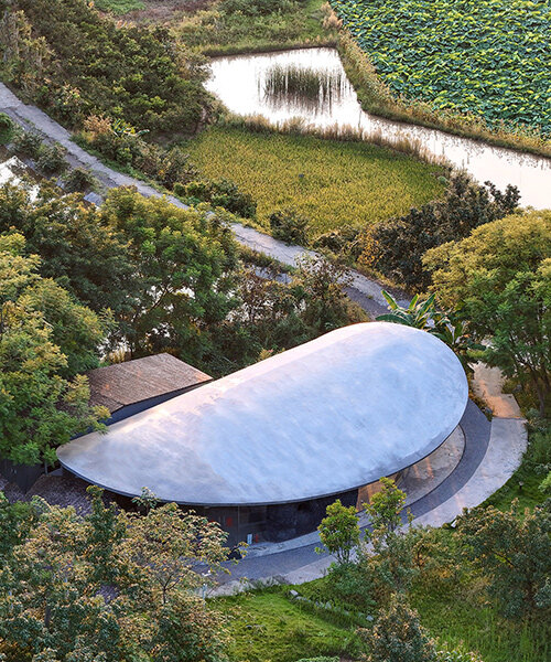 archermit sculpts 'stone kiln in the valley' with petal shaped roof in luzhou