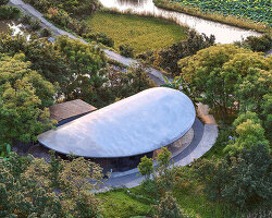 archermit sculpts 'stone kiln in the valley' with petal shaped roof in luzhou