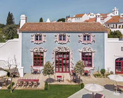 christian louboutin opens vermelho, a boutique hotel in portugal with ornamental red details