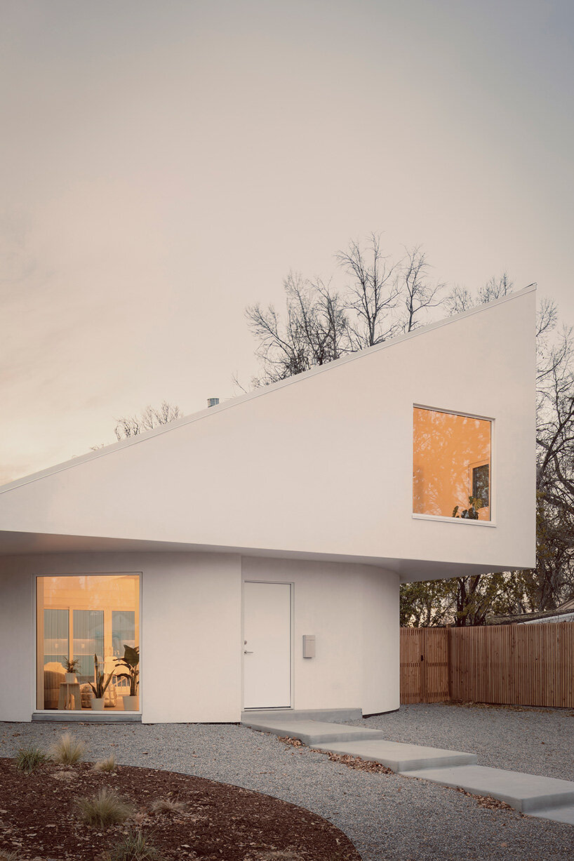 circular ground floor supports shed-roofed volume in NEMESTUDIO's colorado dwelling
