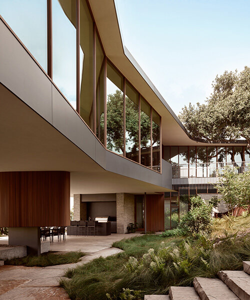 alterstudio's net-positive 'city park residence' bridges sloping site in austin, texas