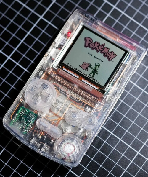 custom nintendo game boy features clear case and copper wires on transparent circuit board