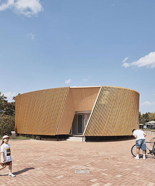 double-layer timber facade enfolds renovated public toilet in korea by daniel valle architects