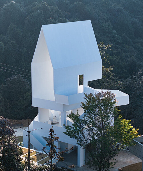 kong xiangwei studio's flying bird art gallery frames the rolling tea gardens of china