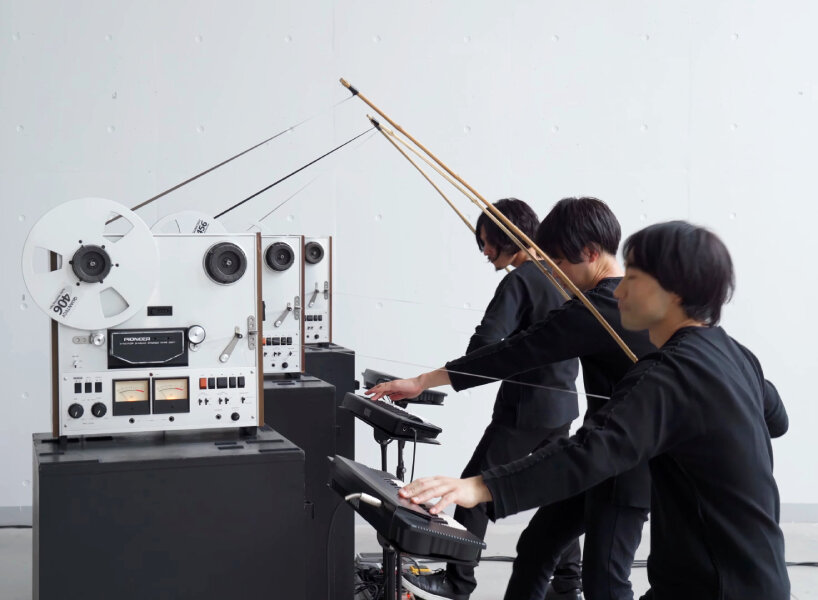 the magnetic tape extends from the machine and stretches through the bamboo bow