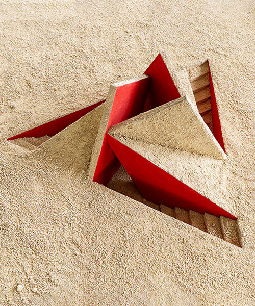 geometric triskele form rises from the earth as hajime yoshida's shrine in japan