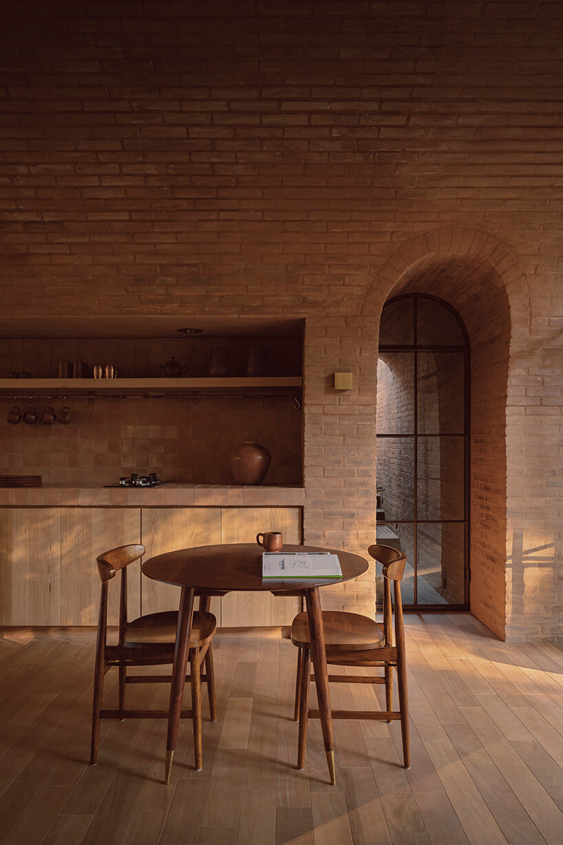 GOMA tucks vaulted cabin into mexican landscape with twin brick towers rising above