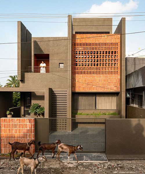 studio nirbaadh's H-house is a composition of layered walls and brick screens in india
