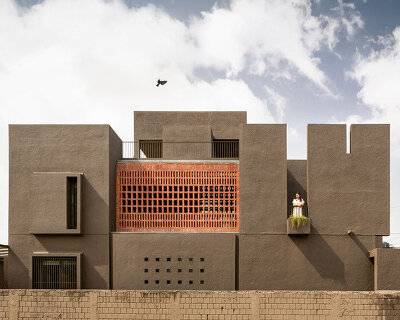 studio nirbaadh's H-house is a composition of layered walls and brick screens in india