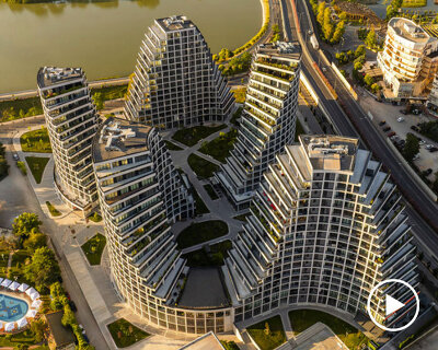 JA joubert architecture sculpts undulating lakefront district following sloped terrain in tirana