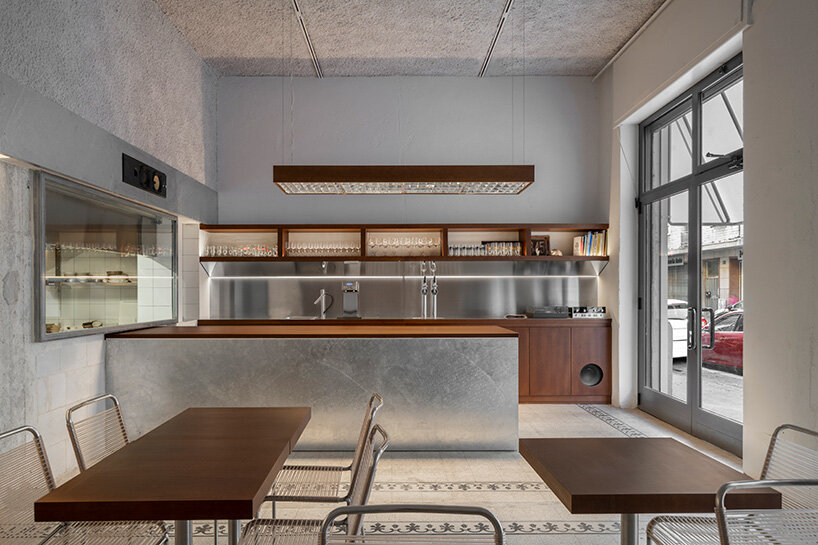 inside this milan wine bar, studiomille creates a cozy gathering space rooted in filipino culture