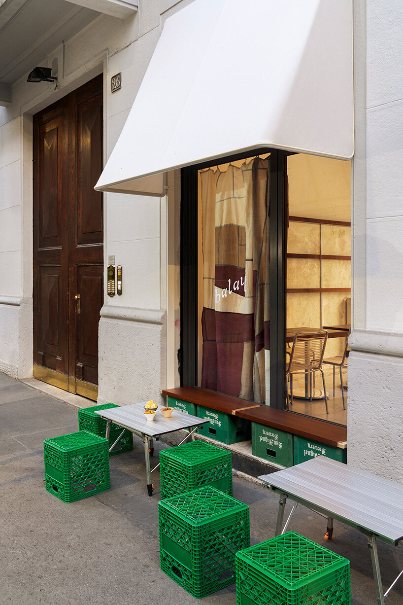 inside this milan wine bar, studiomille creates a cozy gathering space rooted in filipino culture