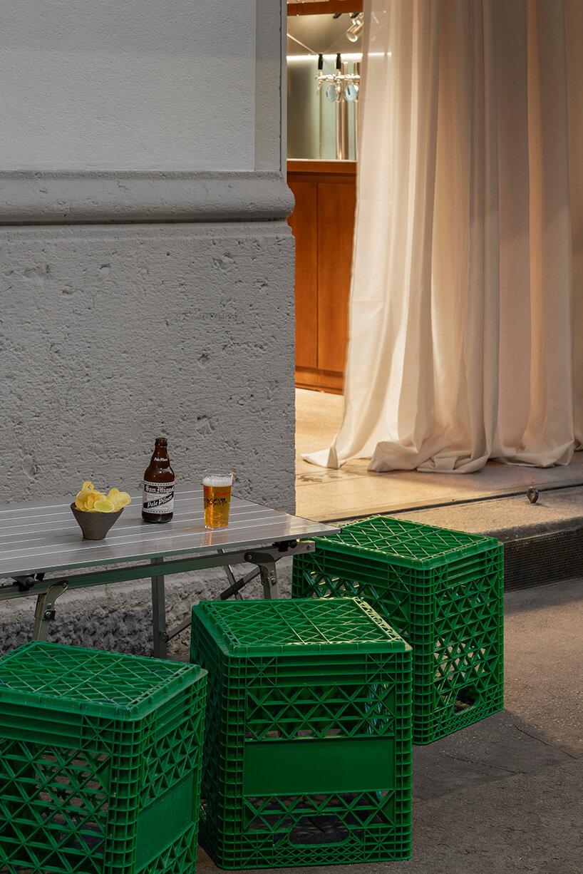 inside this milan wine bar, studiomille creates a cozy gathering space rooted in filipino culture