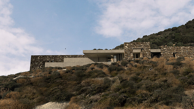 onus embeds net-zero island residence into the greek landscape using local materials