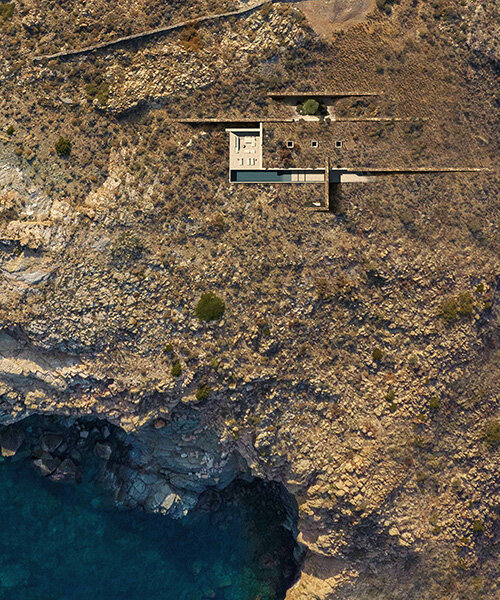onus embeds net-zero island residence into the greek landscape using local materials