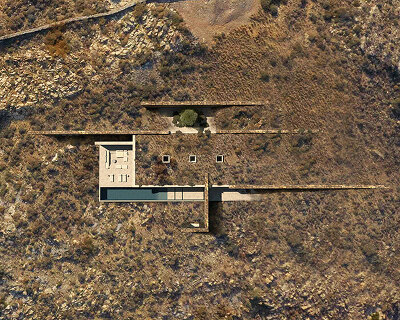 onus embeds net-zero island residence into the greek landscape using local materials