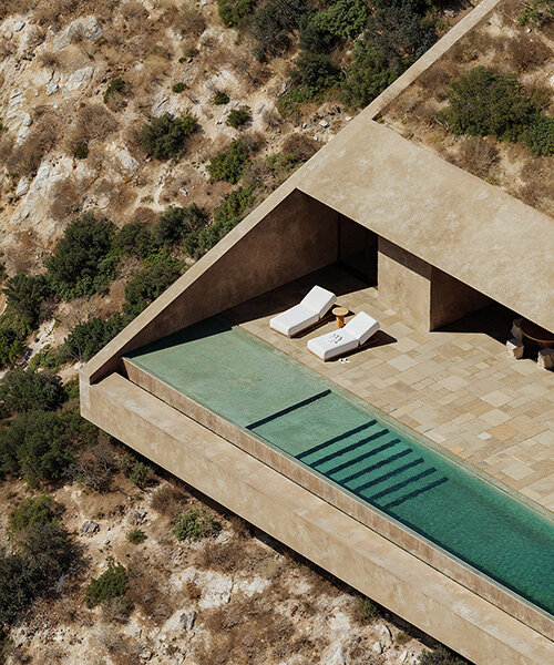 oppenheim architecture designs concrete villa as extension of albania’s coastal cliffs