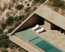 oppenheim architecture designs concrete villa as extension of albania’s coastal cliffs
